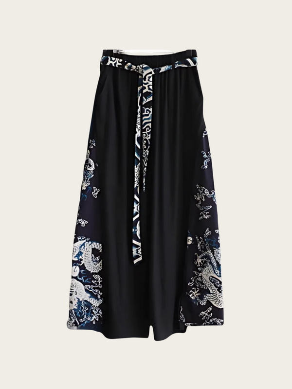 Black skirt with white floral patterns on a light gray background