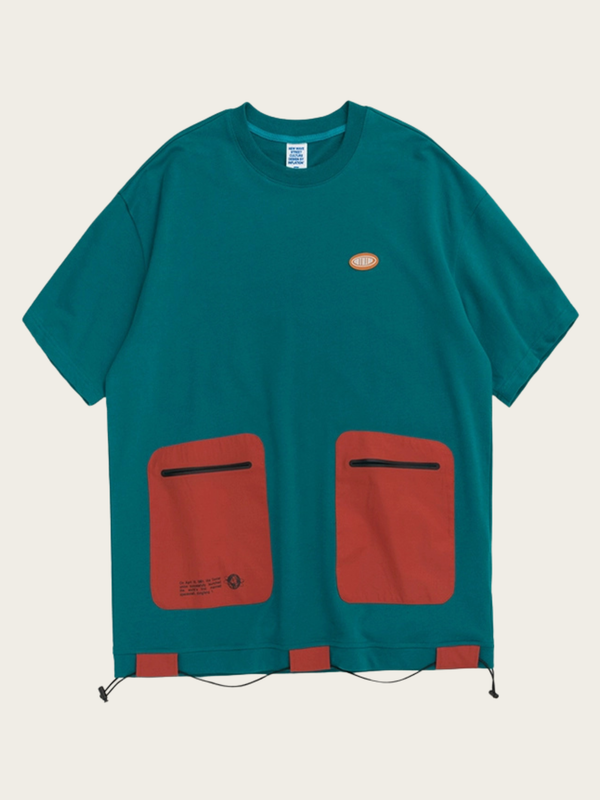 Teal t-shirt with red pockets on a beige background