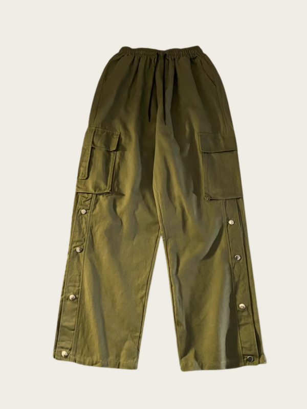Green cargo pants on a beige background