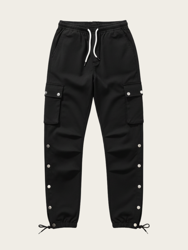 Black cargo pants with button details on a beige background