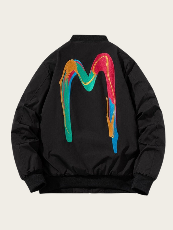 Black jacket with a colorful 'M' design on the back against a beige background
