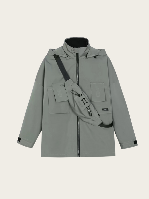 Gray raincoat with a crossbody bag on a light beige background