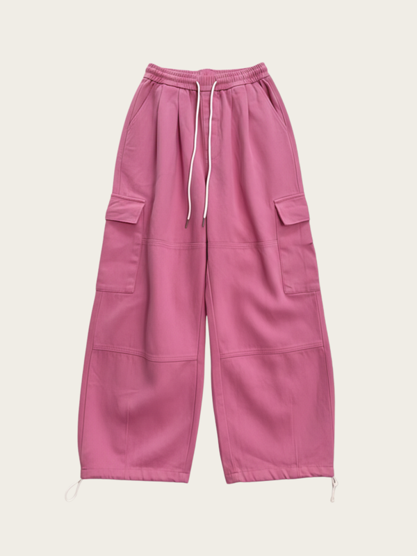 Pink cargo pants on a light pink background