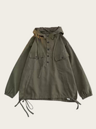 Green jacket with a hood on a beige background