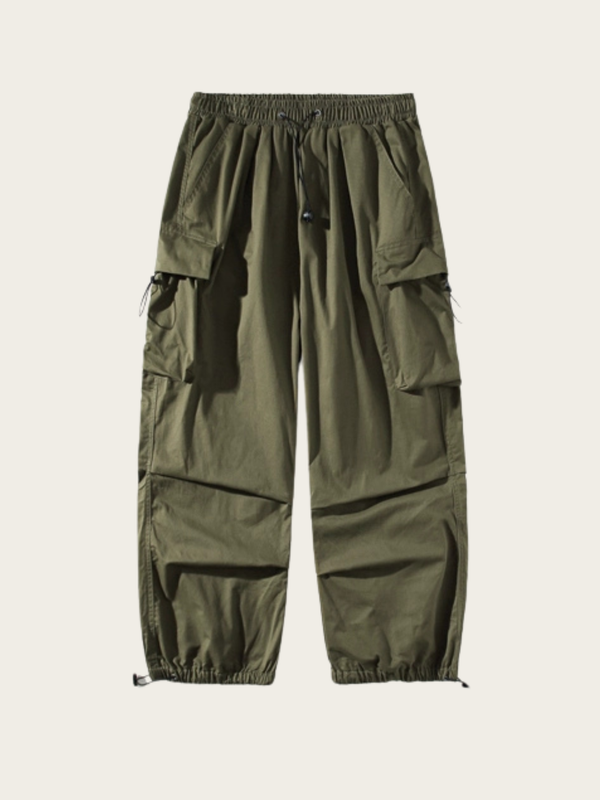 Green cargo pants on a beige background