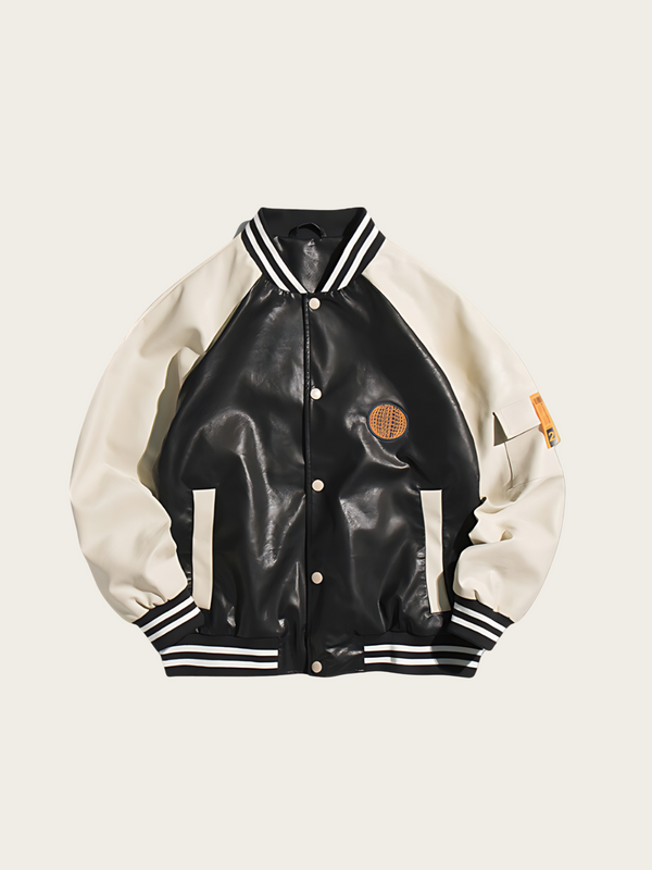Black and white varsity jacket with a patch on a beige background