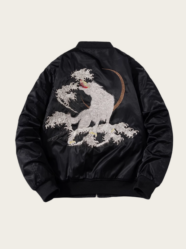 Black bomber jacket with a white embroidered design on a beige background
