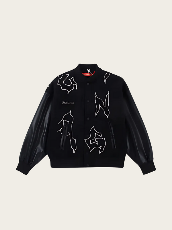 Black jacket with white designs on a beige background