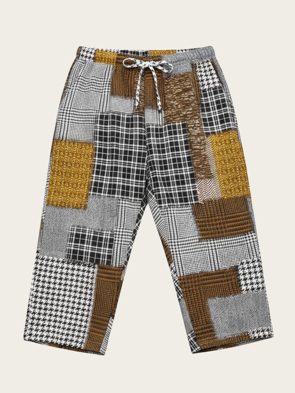 Patchwork patterned pants on a beige background