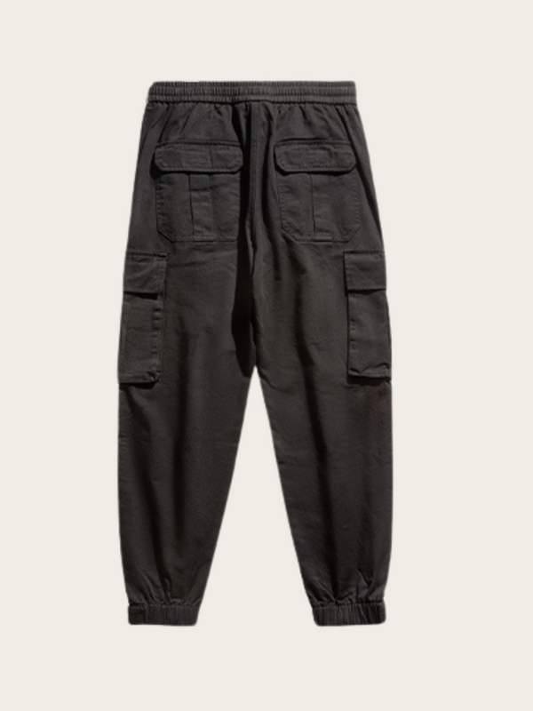 Black cargo jogger pants on a light gray background