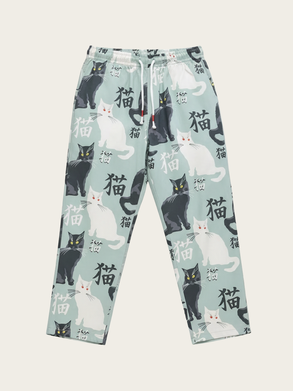 Pajama pants with cat pattern on a light blue background