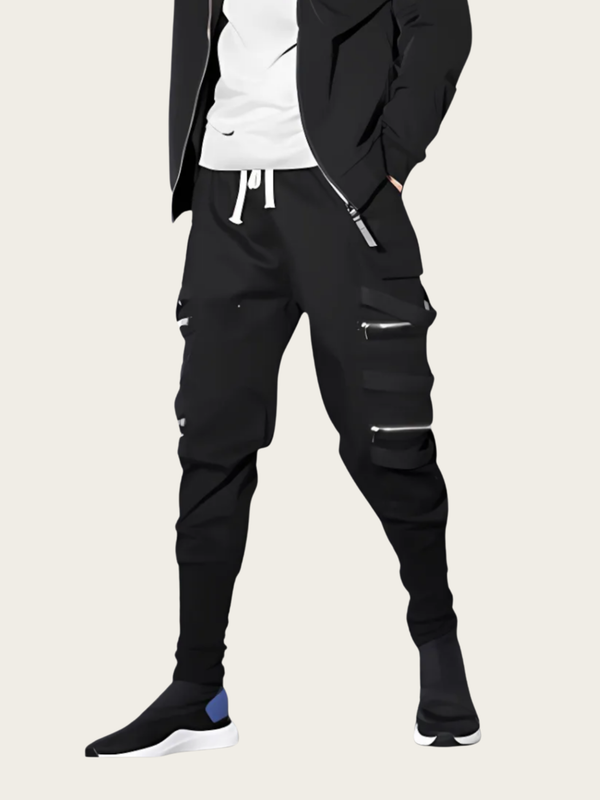 Person wearing black cargo pants with zippers on a white background