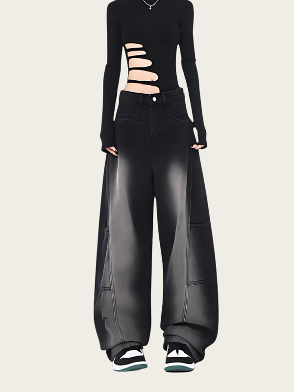Black outfit with cut-out long-sleeve top and wide-leg pants on a beige background
