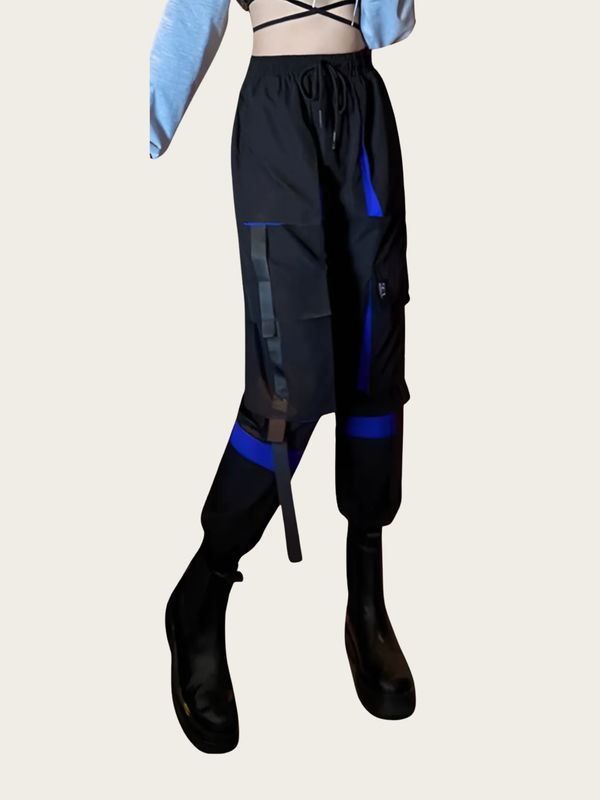 Black and blue pants with a person wearing them on a light gray background