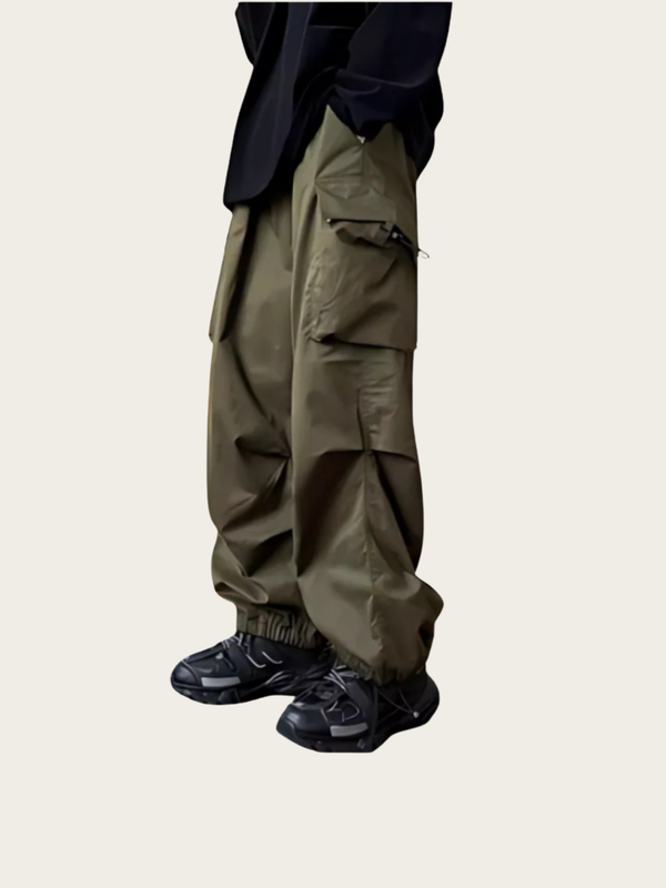 Khaki cargo pants worn by a person on a beige background