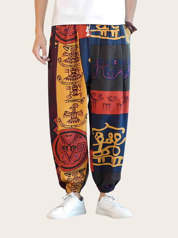 Colorful patterned pants worn by a person on a plain background