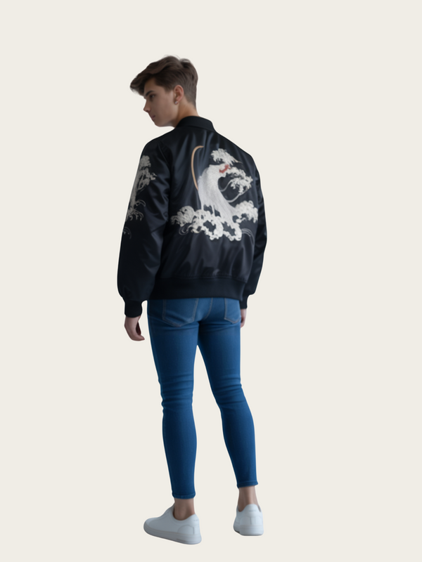 Person wearing a black bomber jacket with a white graphic design on the back, standing against a light gray background.