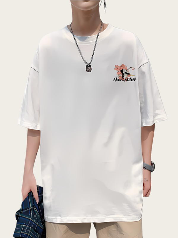 Person wearing a white t-shirt with a small design on a plain background