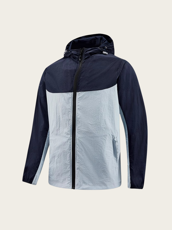 Two-tone jacket with navy and light gray sections on a beige background