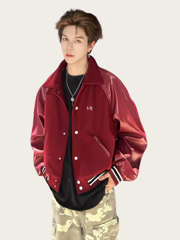 Person wearing a red jacket with a brand logo on a plain background