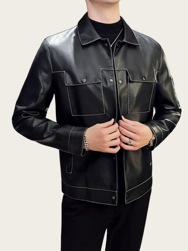 Black leather jacket worn by a person on a plain background