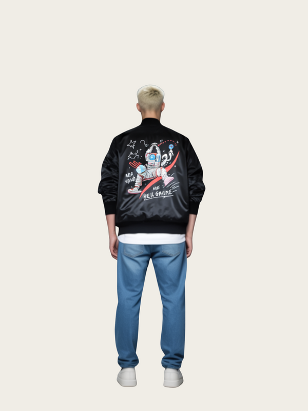 Person wearing a black jacket with graphics and text, standing against a white background