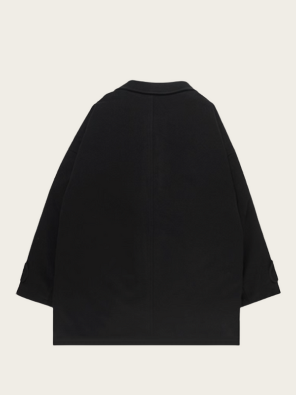 Black cape on a light beige background