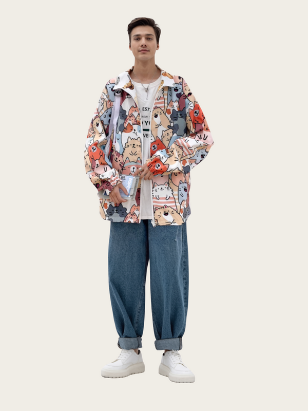 Person wearing a colorful patterned jacket and blue jeans on a white background