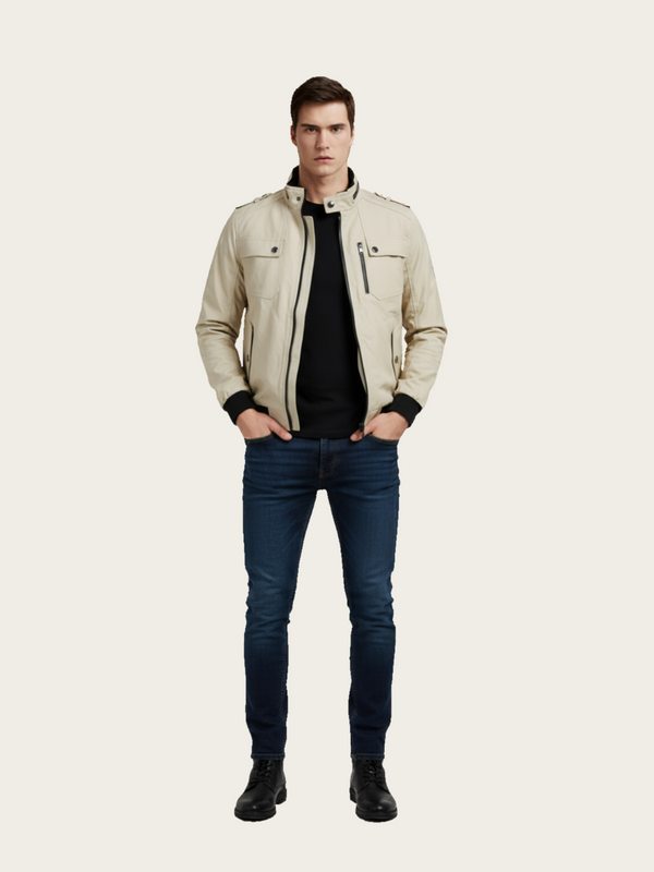 Man wearing a beige jacket, black shirt, and blue jeans on a white background