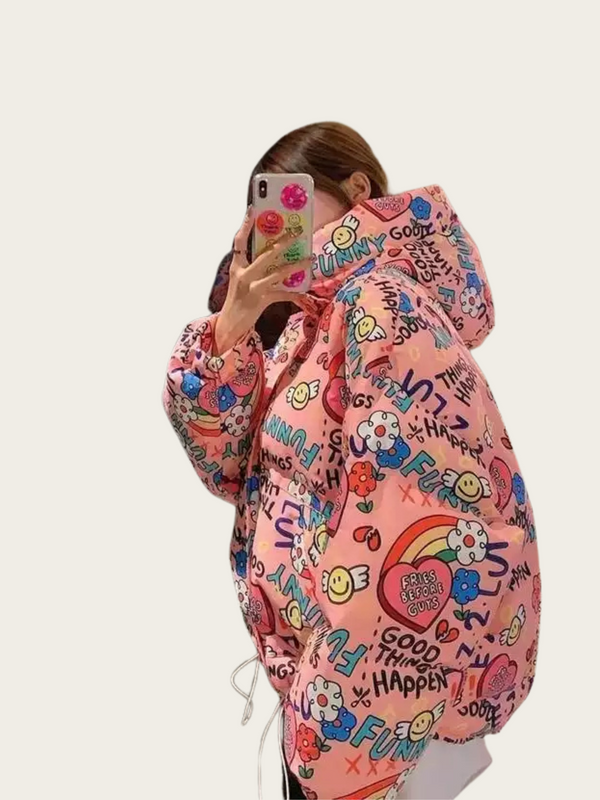 Person wearing a colorful graffiti-style pink jacket with various designs and text.
