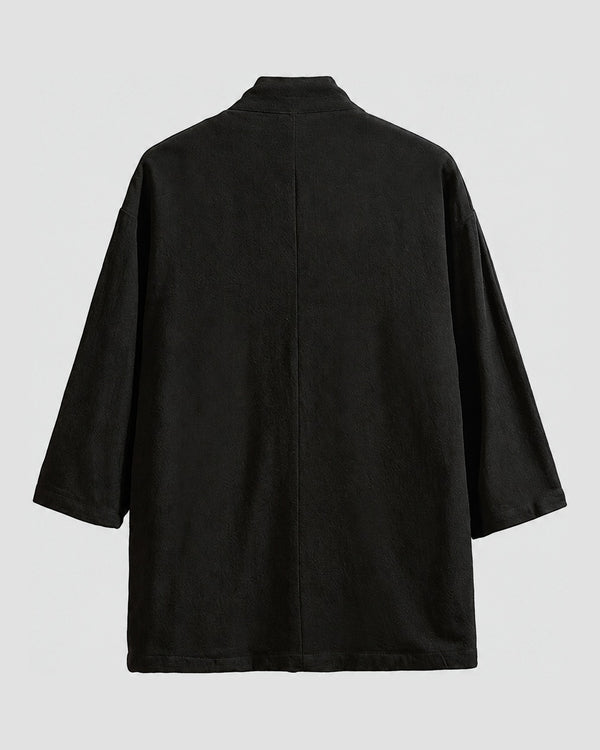 Back of the black linen haori cardigan with a small stand collar and a centre seam