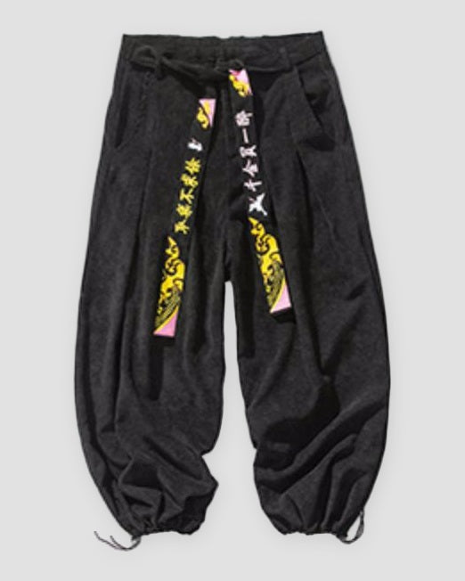 Black corduroy wide-leg pants with two embroidered crane tapes, front view