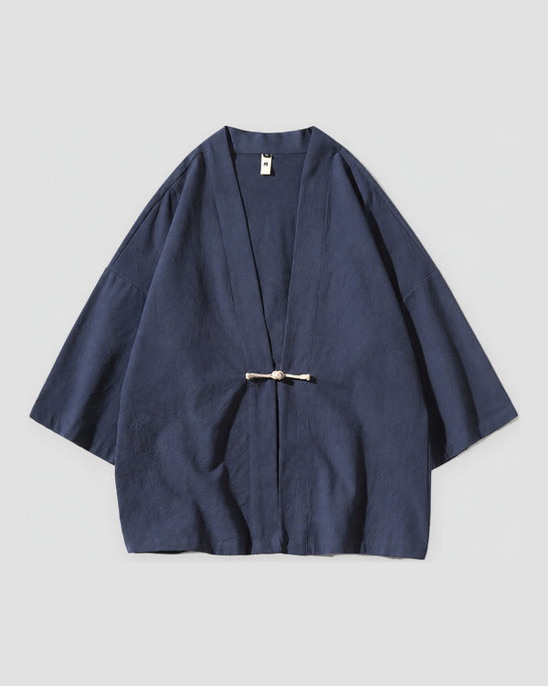 Navy haori jacket with a knotted frog toggle, front view