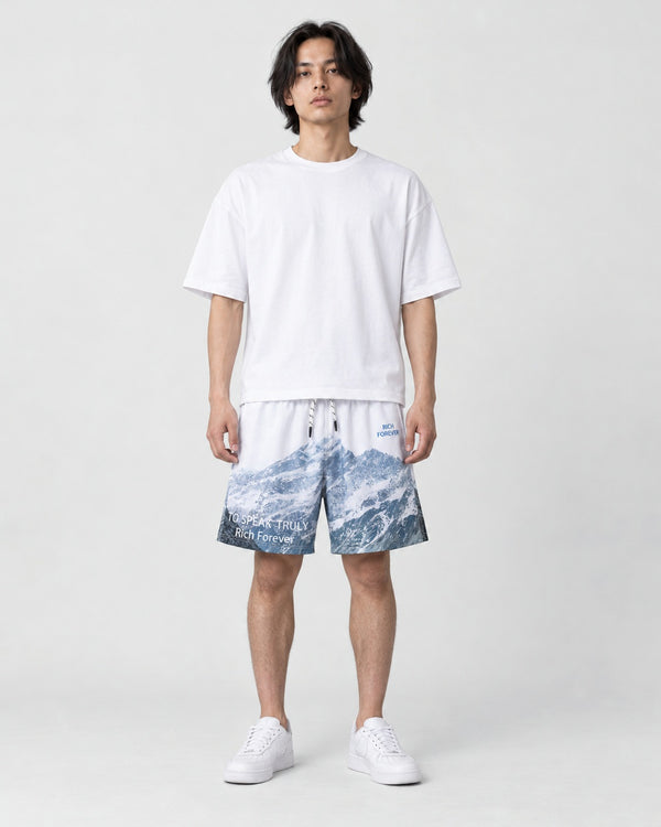 Model wearing the Snowy Mountain Print Shorts, front view