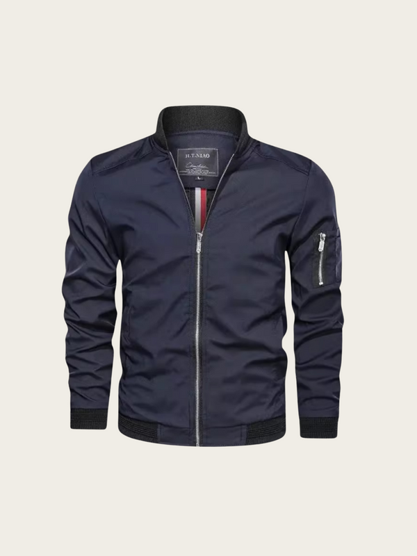 Navy blue jacket with a brand label on a light beige background