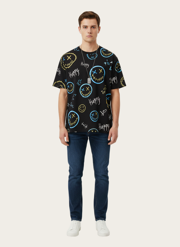 Person wearing a black t-shirt with colorful designs on a white background