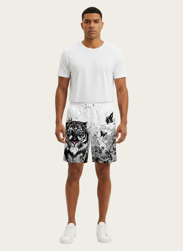 Man wearing a white t-shirt and black and white patterned shorts on a white background