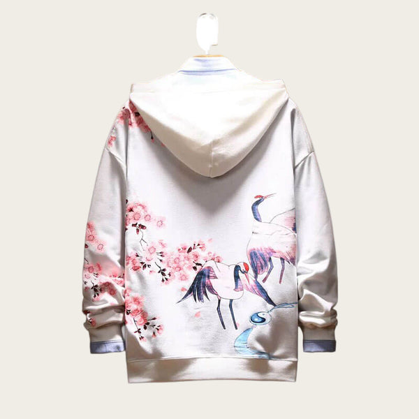 White hoodie with pink flamingo and cherry blossom design on a white background