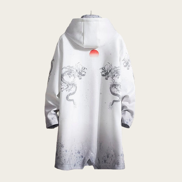 White garment with dragon designs on a stone wall background