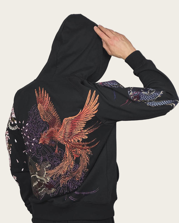 Black hoodie with a colorful eagle design on the back against a plain background