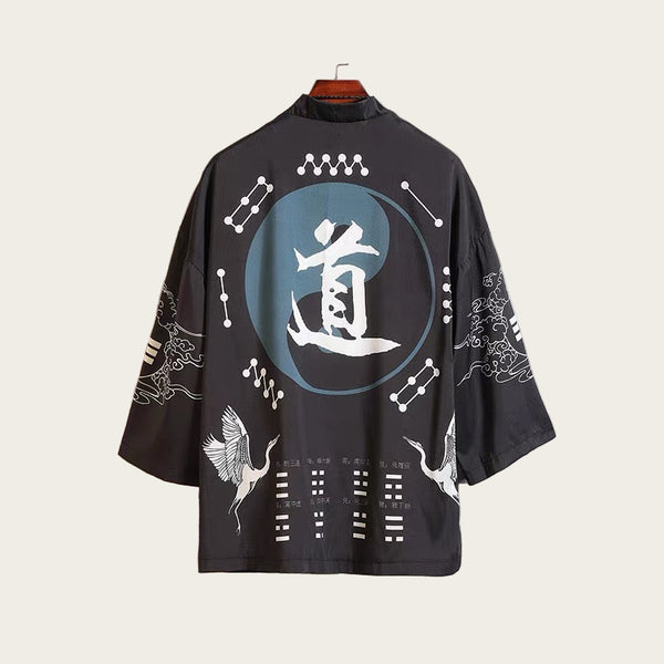 Black kimono-style garment with white symbols and designs