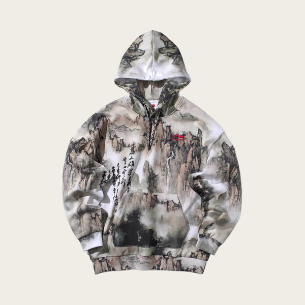 Camouflage hoodie with a brand logo on a white background