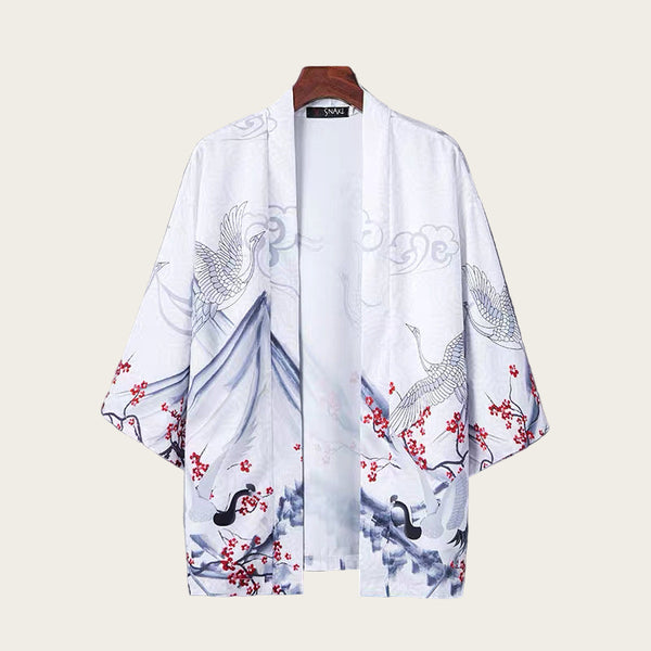 White kimono-style garment with bird and floral patterns on a gray background