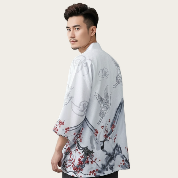 Man wearing a white shirt with black and red floral patterns