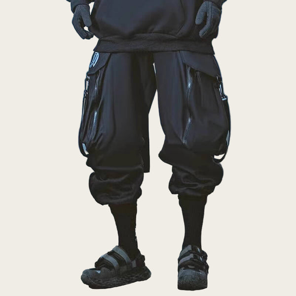 Person wearing dark pants and sandals