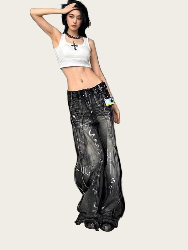 Person wearing a white crop top and black distressed jeans standing