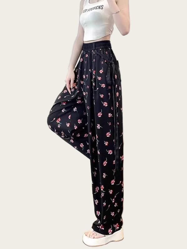 Person wearing black floral pants