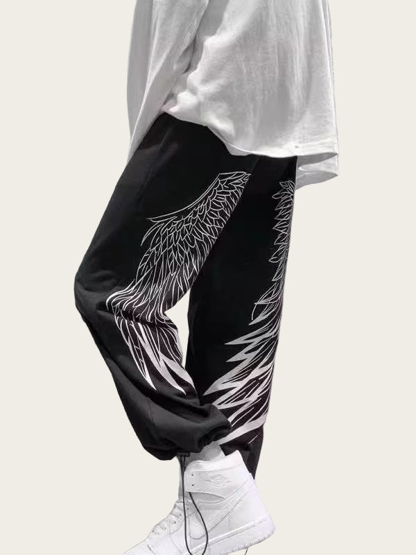 Person wearing black pants with white designs