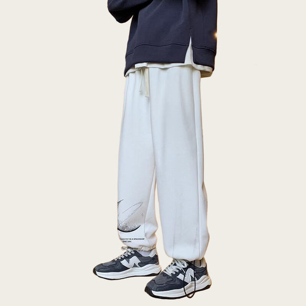 Person wearing white pants and black sneakers