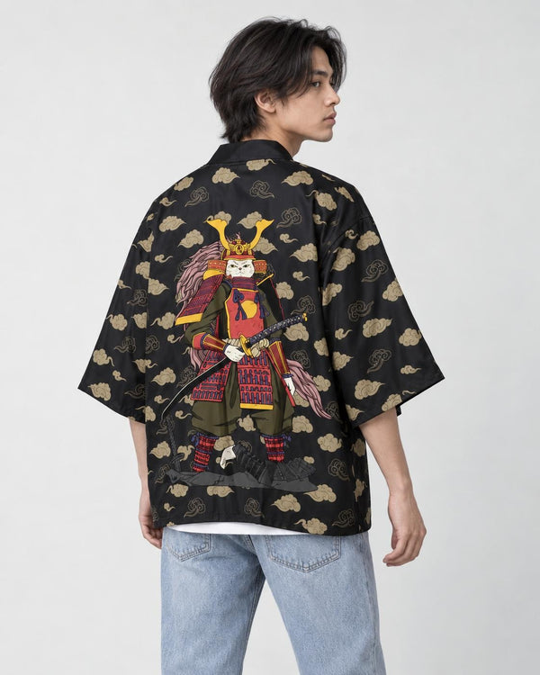 Man in the black haori seen from behind at an angle, with tan clouds and an armored cat on the back, over a white tee